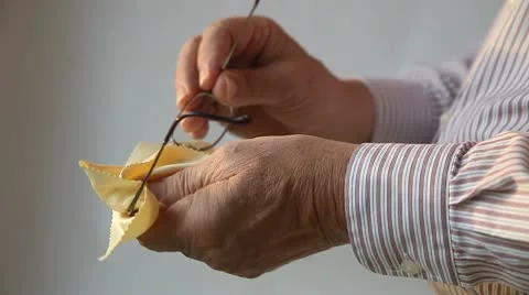 Man cleaning glasses Stock Footage 8979474
