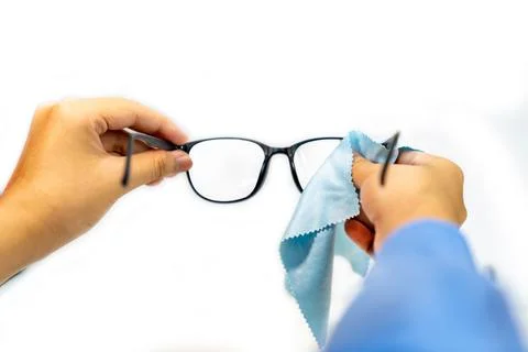The man cleaning glasses withe blue cloth. Stock Photos