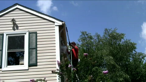 Man cleaning gutters Stock Footage 518221