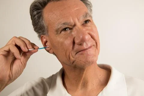 Man Cleaning his Ears Stock Photos