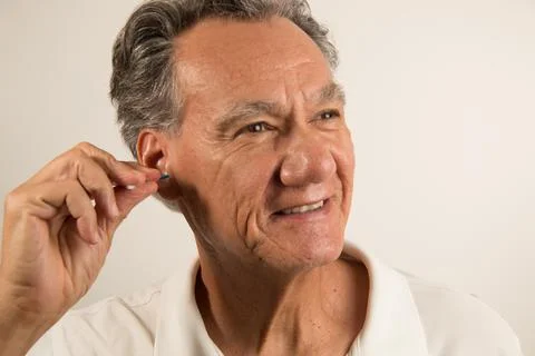 Man Cleaning his Ears Stock Photos