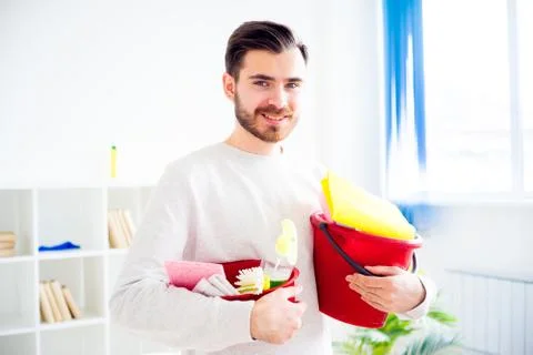 Man cleaning the house Stock Photos