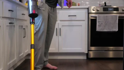 Man Cleaning House While Working From Home Stock Footage 325732367