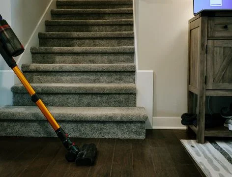 Man Cleaning House While Working From Home Stock Photos
