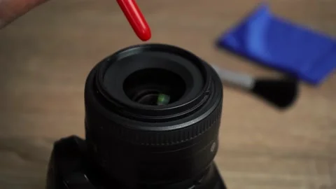 Man is cleaning the lens. Stock Footage 153934181