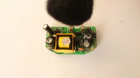 Man is cleaning micro scheme processor hardware chip with the brush Stock Footage 47028865