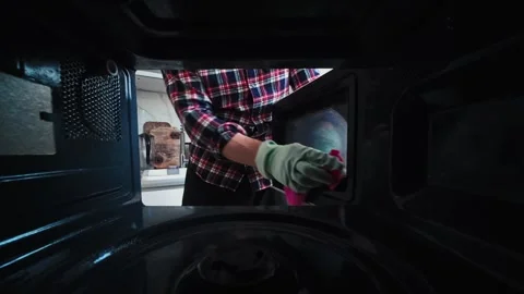 Man Cleaning Microwave Oven Inside Stock Footage 339080963