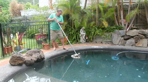 Man Cleaning Pool Stock Footage 34497458