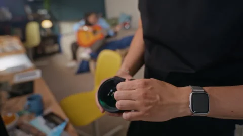 Man Cleaning Professional Camera Lens with Microfiber Cloth Stock Footage 341947853