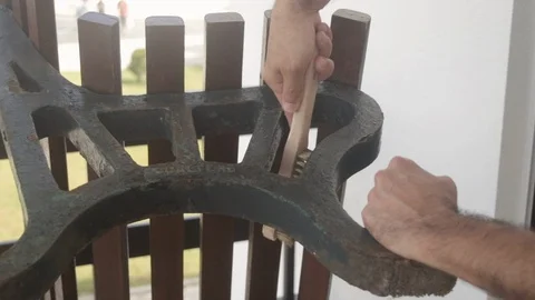 Man cleaning rust on branch with brush Video stock 116742120