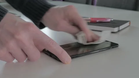 Man cleaning smartphone screen with alcohol. Stock Footage 150867982