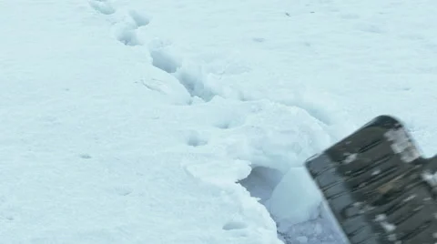Man Cleaning Snow From Pavement Stock Footage 61287185