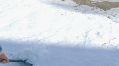 Man Cleaning Snow From Pavement Stock Footage 61287362