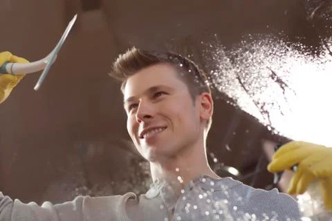 Man cleaning window pane Stock Photos