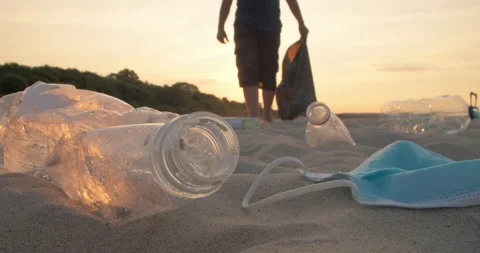 Man cleans the beach from plastic garbage. Stock Footage 171858464