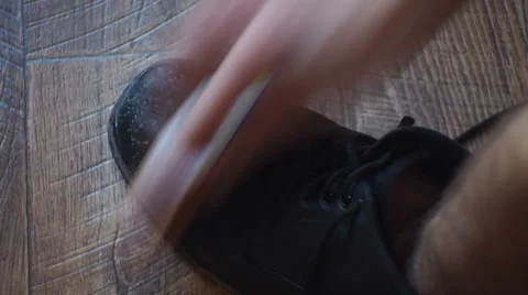 Man cleans boot Video stock 35422094