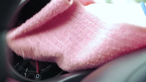 The man cleans the car from the dust using a damp cloth. Stock Footage 130861884