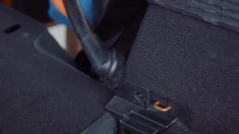 Man cleans car interior with vacuum cleaner Stock Footage 93483816