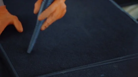 Man cleans car interior with vacuum cleaner Stock Footage 93485195