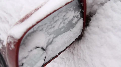 A man cleans a car from the snow Stock Footage 1002257