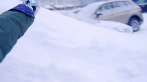 Man cleans the car from snow. Close-up. Video stock 145460213