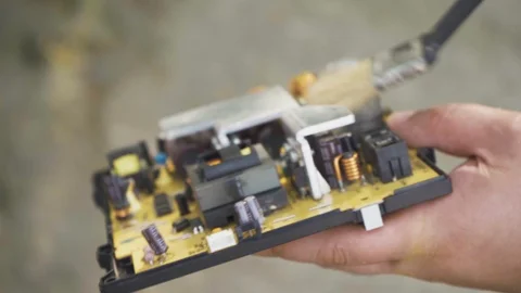 Man cleans the computer board from dust with a brush Stock Footage 108565158