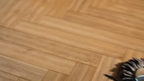A man cleans the floor with a mop in the kitchen of an apartment Stock Footage 265059006
