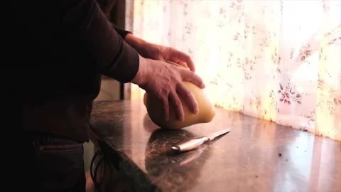 A man cleans fruit with his hands in the kitchen Stock Footage 162714753
