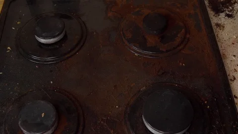Man cleans gas stove Stock Footage 112701774