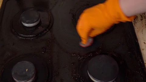 Man cleans gas stove Stock Footage 112992463