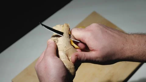 Man cleans ginger Stock Footage 146146850
