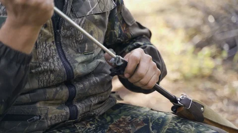 A man cleans a gun Stock Footage 117145161