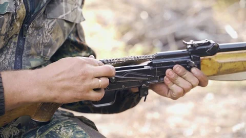 A man cleans a gun Stock Footage 117145274