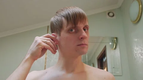 Man Cleans His Ears Stock Footage 149345430