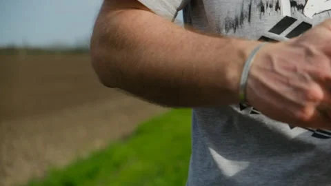 Man cleans his hands with damp antibacterial cloth, because this must be done Stock Footage 154221686
