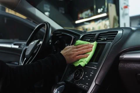 Man cleans interior of car Stock Photos