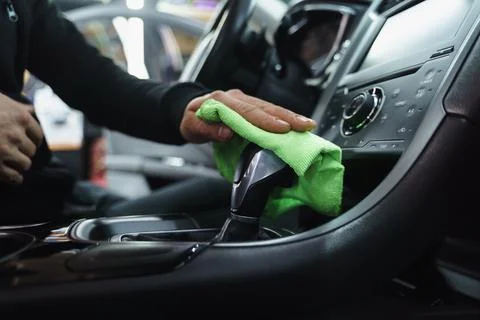 Man cleans interior of car Stock Photos