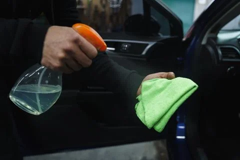 Man cleans interior of car Stock Photos