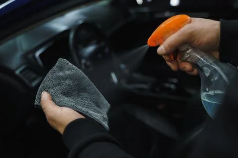 Man cleans interior of car Stock Photos