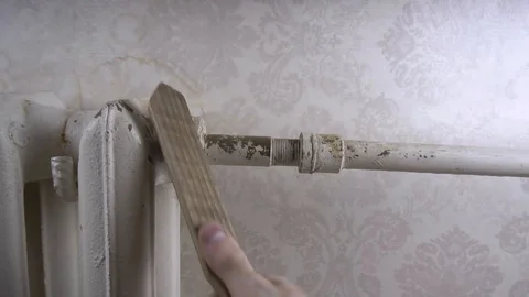 A man cleans an old battery from rust Stock Footage 116129186