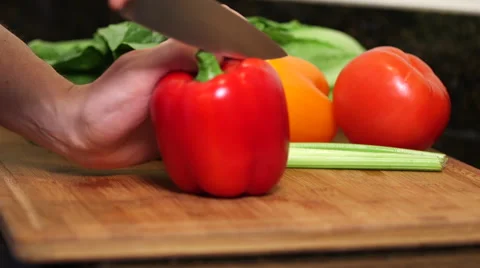 Man cleans out red bell pepper seeds close up Stock Footage 61353765