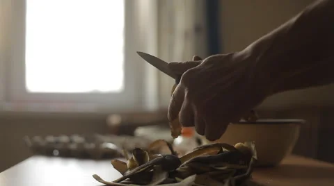 A man cleans the potatoes in the kitchen 스톡 동영상 59133707