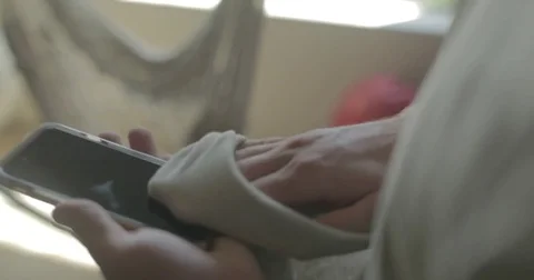 Man cleans smartphone at home Stock Footage 78037946