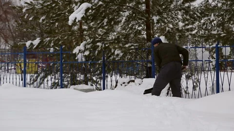 Man cleans snow shoveling Stock Footage 60820701