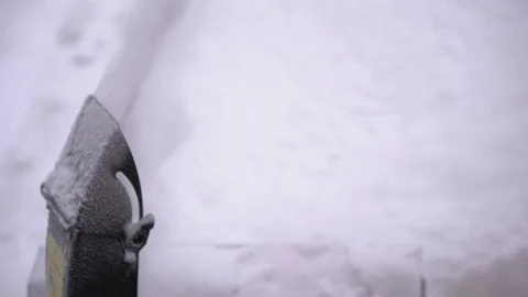 A man cleans snow from sidewalks with snowblower Stock Footage 84666537