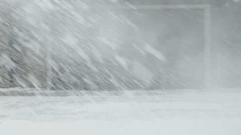 Man cleans snow with a snow thrower left to right Stock Footage 125821624