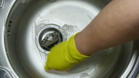 A man cleans the surface of the sink Stock-Footage 123660558