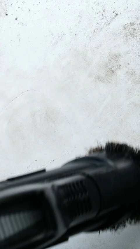 A man cleans the white surface of the dust with a vacuum cleaner. Hand clos.. Stock Footage 291949549
