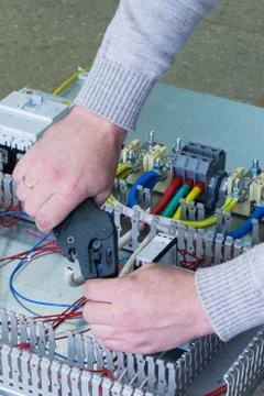 Man cleans the wire Stock Photos