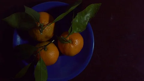 The man cleared the tangerine. 動画素材 83160654